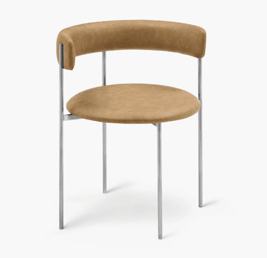 A modern armless dining chair featuring a circular upholstered seat and a curved, semi-circular upholstered backrest, supported by a minimalist silver-colored metal frame with four slender legs. — 3D model