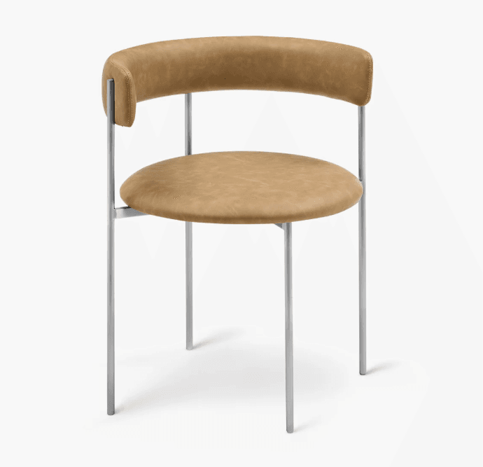 A modern armless dining chair featuring a circular upholstered seat and a curved, semi-circular upholstered backrest, supported by a minimalist silver-colored metal frame with four slender legs. — 3D model
