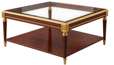A square coffee table featuring a clear glass top, a dark wooden frame with a lower shelf, and intricate gilded brass ornamentation including trim, fluted legs, and decorative corner capitals. — 3D model
