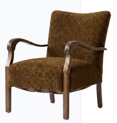 An upholstered armchair featuring a rich, dark brown, shaggy fabric upholstery on the seat and back, contrasted with an exposed dark wood frame. The wooden armrests display distinctive carved leaf or scroll motifs at their front curves, transitioning into straight, square-profile legs. The overall design suggests a vintage aesthetic. — 3D model