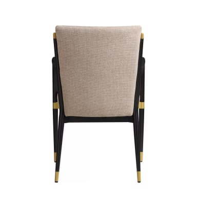 A contemporary upholstered armchair featuring a black metal frame with brass details and beige fabric upholstery. The chair has a sleek, modern design with integrated curved armrests. — 3D model