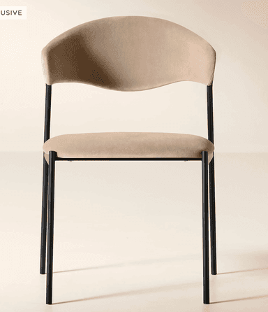 A modern dining chair featuring a black metal frame and light beige upholstered seat and a distinctively curved backrest. — 3D model