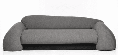 A contemporary sofa with a rounded, organic silhouette. It features a thick, plush seat and backrest upholstered in a textured gray fabric. The armrests are uniquely shaped, widening and curving outwards at the ends, creating a distinctive, sculptural form. The base of the sofa is a solid, dark-colored rectangular block, providing a contrasting foundation to the soft upholstery. — 3D model