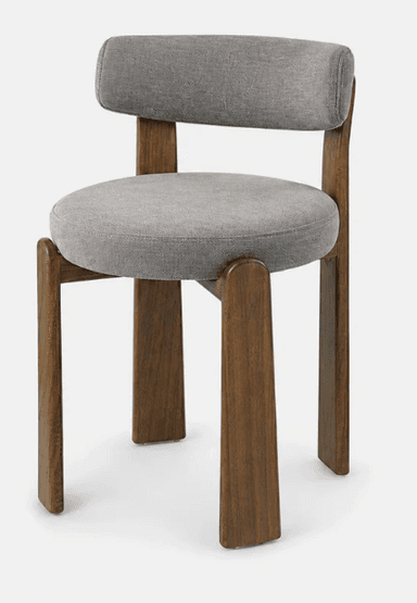 An armless chair featuring a robust dark brown solid wood frame and light gray fabric upholstery on the seat and backrest. The design is minimalist with clean lines, showcasing a contemporary aesthetic. The backrest is attached to vertical wooden supports that extend upwards from the rear legs, creating a visually integrated structure. The seat and back cushions are well-padded and have softly rounded edges. — 3D model