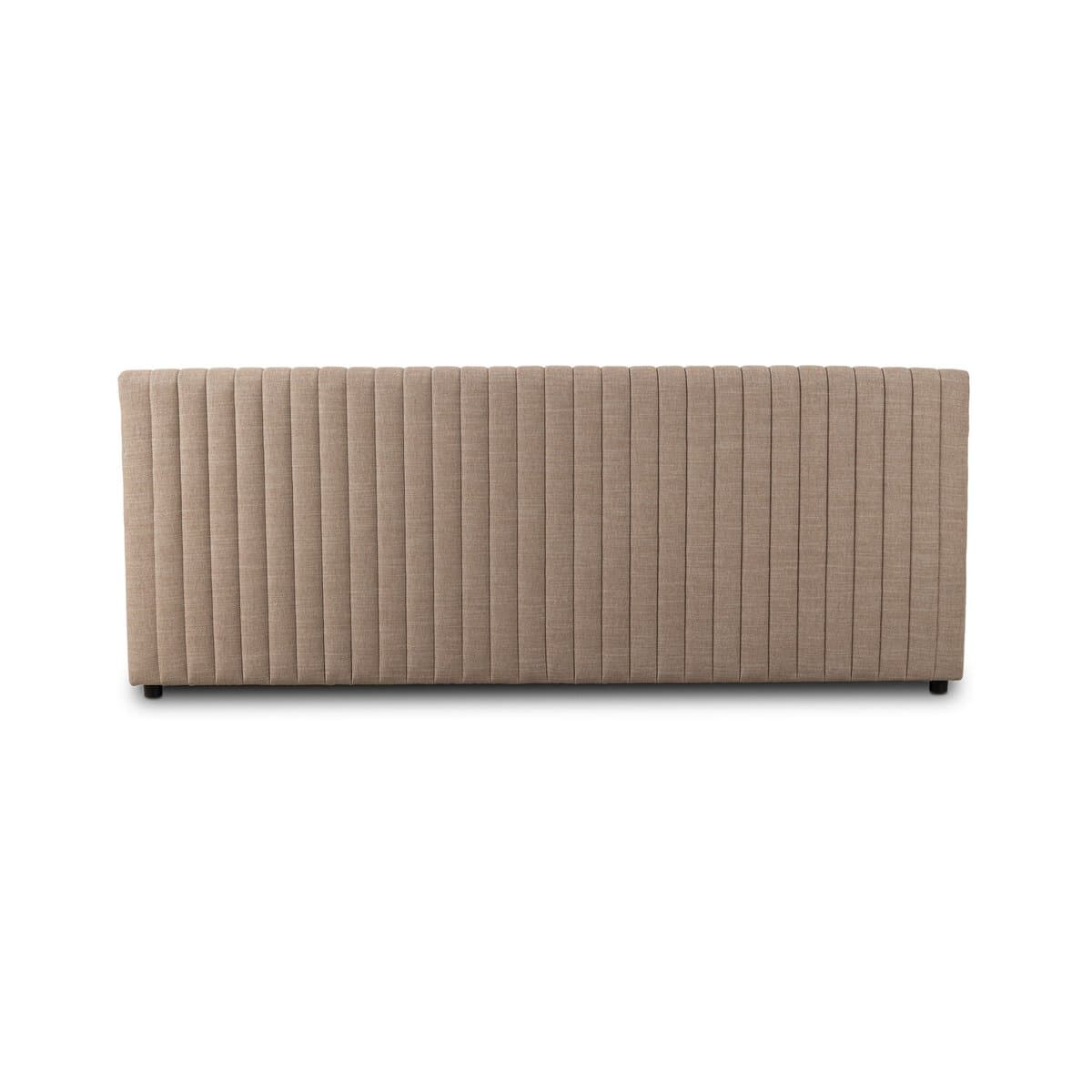 A rectangular upholstered headboard with vertical channel tufting. The headboard has a flat top edge and appears to be designed to attach to a bed frame or wall. It rests on small, dark-colored feet. — 3D model