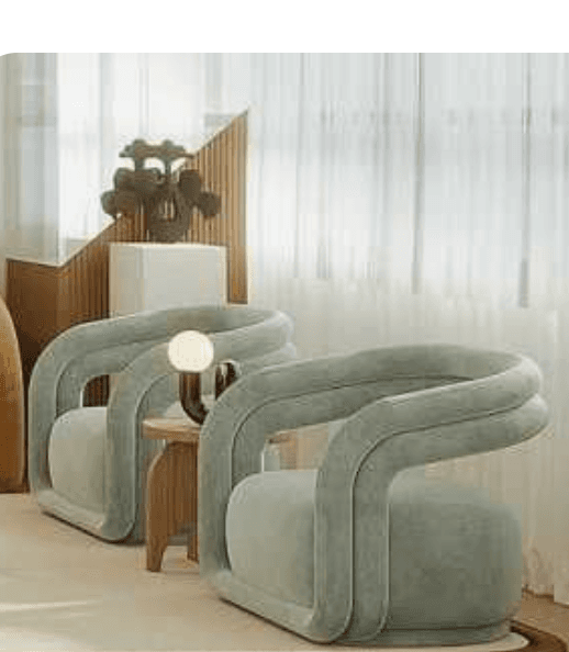 A modern armchair with a rounded, sculptural design. The armchair features a thick, tubular frame that forms the arms and backrest, which appears to be upholstered in a soft, plush fabric. The seat is wide and cushioned, providing a comfortable seating surface. The overall aesthetic is contemporary and inviting. — 3D model