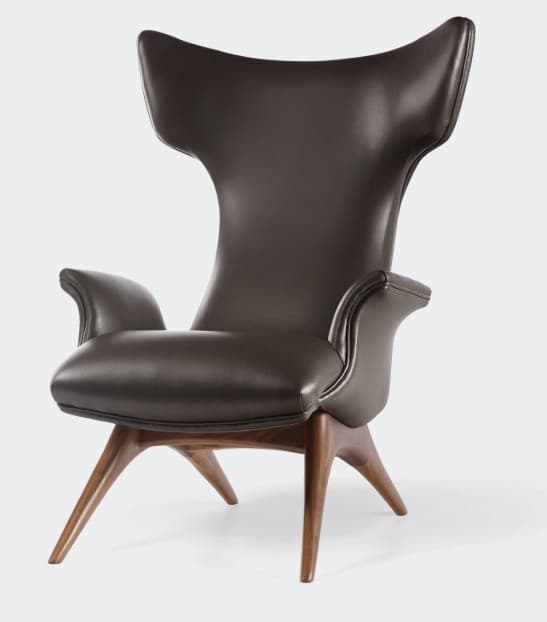 A contemporary wingback lounge chair featuring dark brown leather upholstery and a sculpted wooden base. The chair has a distinctive high back with wing-like extensions, elegant curved armrests, and a splayed four-legged support structure made of wood. — 3D model