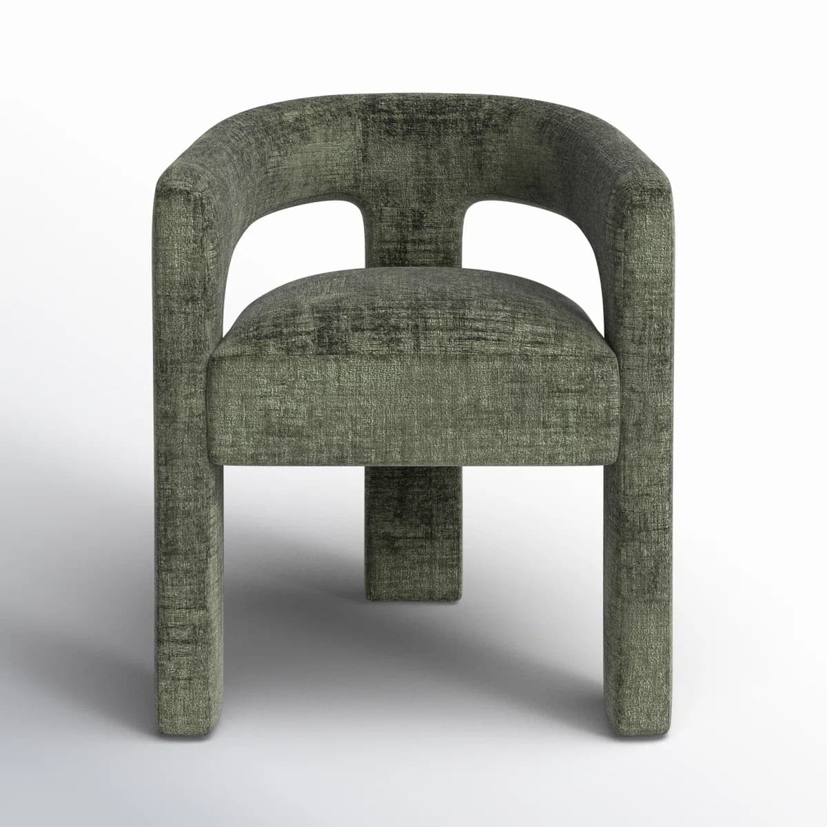 A modern armchair upholstered in a textured, dark green fabric. It features a curved backrest with two large cut-out openings, providing a unique visual element. The seat and armrests are integrated into a blocky, minimalist frame, supported by solid, rectangular legs. The overall design is contemporary and sculptural. — 3D model