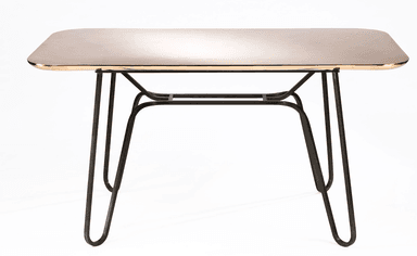 A rectangular dining table with rounded corners. The tabletop has a polished, reflective surface with a warm metallic tone, possibly brass or copper, and a distinct gold-toned edge trim. The base consists of four slender, dark-colored metal legs that splay outwards and are connected by a central, minimalist metal frame. — 3D model
