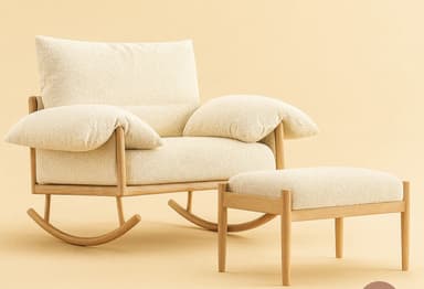 A contemporary rocking chair featuring a light-toned wooden frame and plush, cream-colored boucle fabric upholstery. The chair has a distinctive curved rocker base and thick, comfortable cushions for the seat, back, and armrests, suggesting a focus on comfort and a modern, inviting aesthetic. — 3D model
