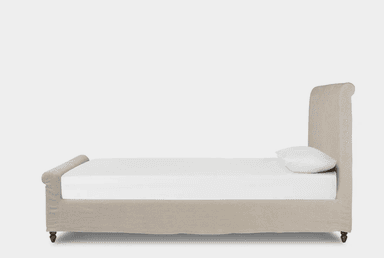 An upholstered bed featuring a rectangular headboard and a fabric-wrapped frame, supported by turned wooden feet, presented against a plain background. — 3D model