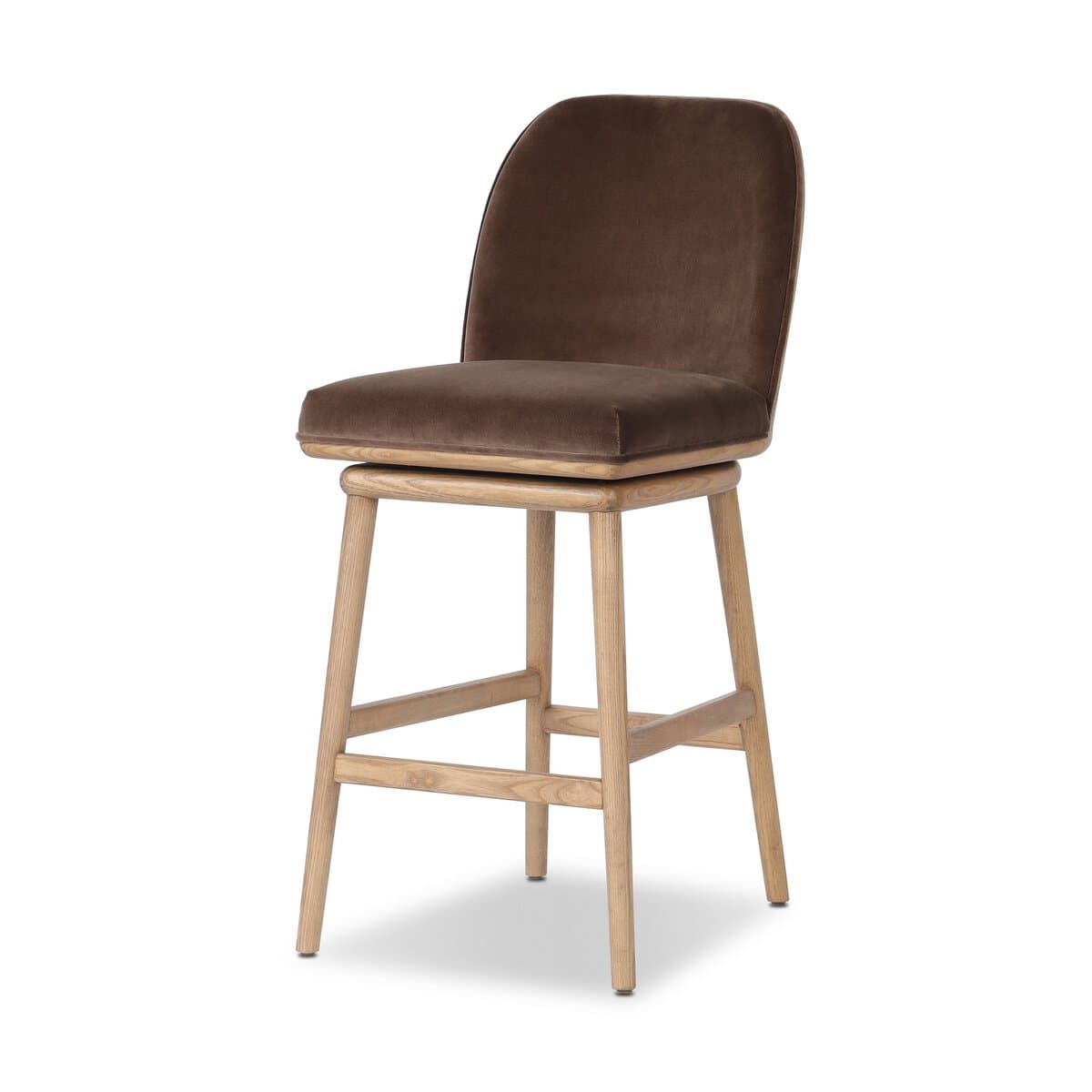 A bar stool with a wooden base and a upholstered seat and backrest. The stool has a swivel mechanism. The wooden legs are angled outwards, and there are crossbars for stability. The seat and backrest are covered in a textured fabric, likely velvet, in a brown hue. — 3D model