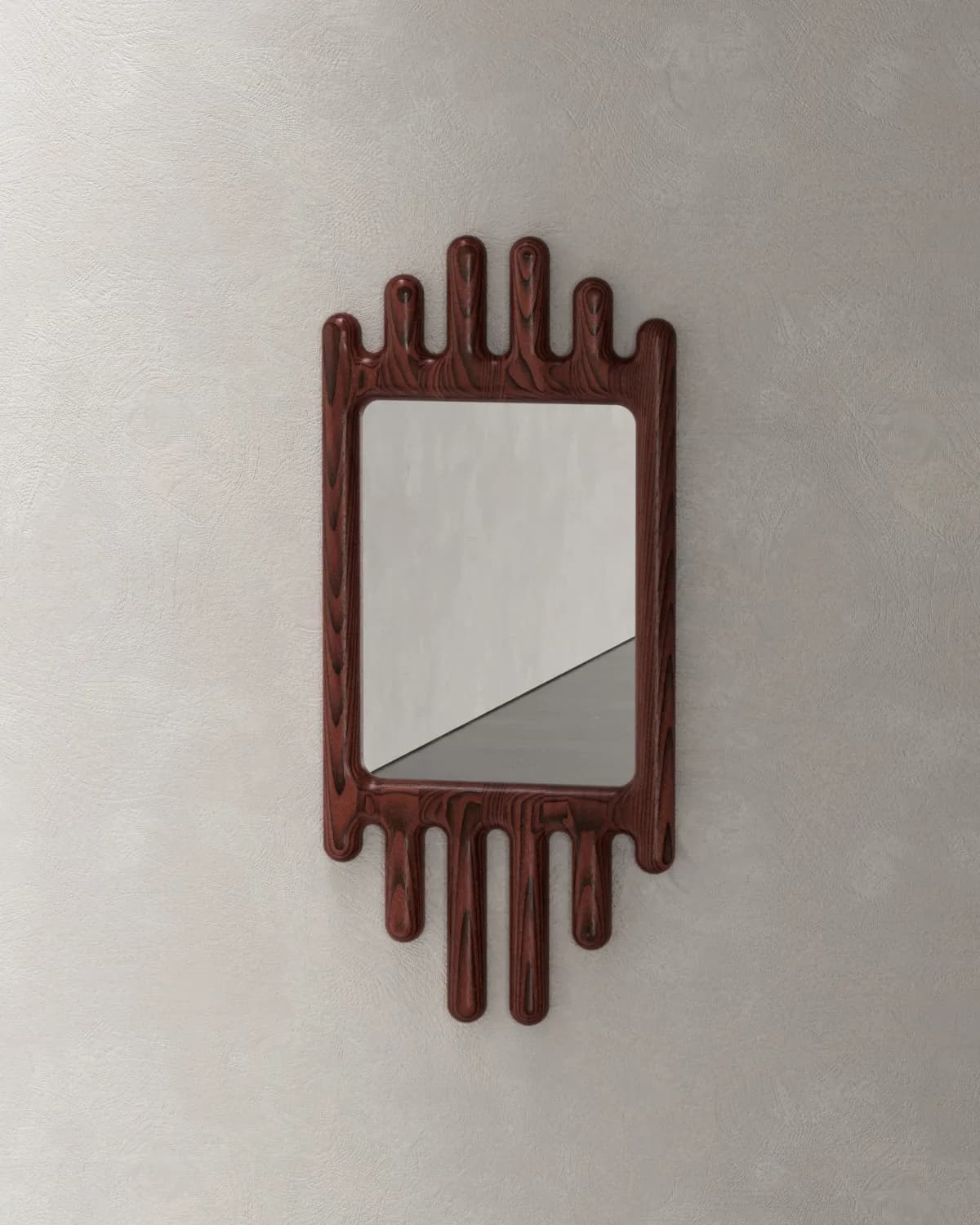 A wall-mounted mirror featuring a rectangular reflective surface encased in a distinctive dark wood frame. The frame exhibits an abstract, organic design with rounded, elongated protrusions extending from its top and bottom edges, reminiscent of dripping or melted material. The wood displays a rich, reddish-brown hue with visible grain patterns. — 3D model