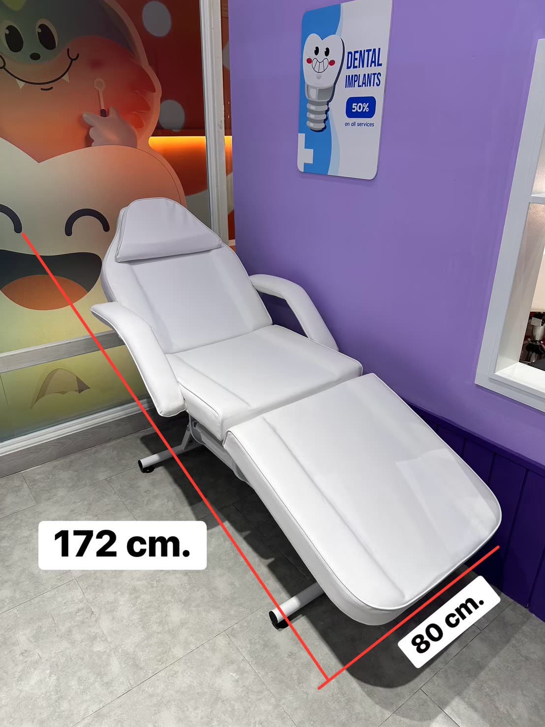 A white adjustable aesthetic treatment chair with a segmented, upholstered surface, metal frame, and removable armrests. It is designed for client comfort during beauty, spa, or medical procedures. — 3D model