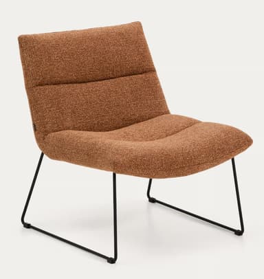 An armless lounge chair featuring a low-slung, ergonomic design. The chair is fully upholstered in a textured, terracotta brown fabric, with segmented cushions forming the backrest and seat. It rests on a minimalist black powder-coated metal sled base, giving it a contemporary aesthetic. The overall profile suggests comfort and relaxation. — 3D model