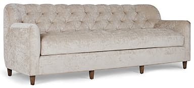 A traditional three-seater sofa featuring deep button tufting across its backrest and inner arms. It is upholstered in a light beige crushed velvet or velour fabric, providing a rich texture. The sofa has gently rolled arms and a single, long seat cushion. It is supported by four short, dark wooden legs. — 3D model