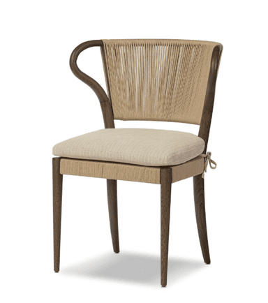 A modern armchair with a curved wooden frame and a woven backrest. The seat is upholstered with a neutral-colored fabric. The armrests are also formed from curved wooden elements, seamlessly integrating into the backrest structure. The woven back features vertical cords creating a textured surface. A tie closure secures the seat cushion. — 3D model