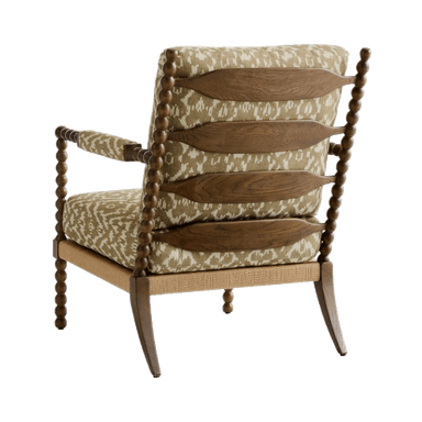 An upholstered armchair featuring a distinctive spool-turned wooden frame, ikat-patterned fabric, and a rope-wrapped seat base. — 3D model