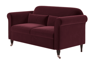 A traditional two-seater loveseat upholstered in deep burgundy velvet. It features classic rolled arms, two loose seat cushions, and two loose back cushions. The frame rests on short, dark wooden legs, with the front legs terminating in brass caster wheels for mobility. The overall design suggests a classic or Victorian-inspired aesthetic. — 3D model