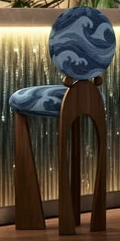 A highly stylized dining chair featuring a dark wooden frame and circular upholstered seat and backrest. The upholstery displays a blue and white wave pattern. The chair has uniquely shaped legs, with two splayed front legs and one curved back leg, connected to the backrest by spherical wooden elements. — 3D model