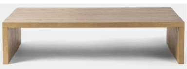 A rectangular coffee table constructed entirely from light-colored solid wood, featuring a minimalist slab design. The tabletop and legs form a continuous, block-like structure with visible wood grain. — 3D model