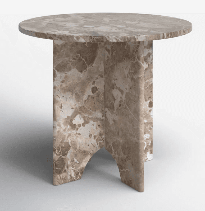 A round side table with a pedestal base. The tabletop is flat and circular, with a beveled edge. The base is composed of multiple curved and straight panels, forming a sculptural pedestal. The entire piece is constructed from a beige and brown veined marble. — 3D model