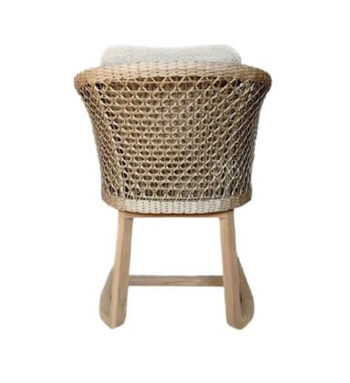 A modern armchair with a woven rattan back and sides, a cushioned seat and backrest, and a light wood frame. The armchair has curved armrests and a contemporary aesthetic, suitable for indoor or outdoor use. — 3D model