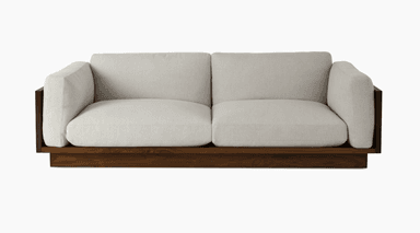 A modern sofa with a low-profile wooden base and frame. The seating and back cushions are upholstered in a light-colored fabric. The armrests are integrated into the wooden frame, creating a distinct geometric shape on the sides. — 3D model
