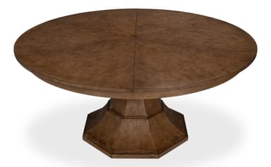 A round dining table with a pedestal base. The tabletop is constructed from segmented wooden panels arranged in a starburst pattern. The pedestal base is octagonal and has a faceted design. The wood exhibits a visible grain texture and a medium brown finish. — 3D model