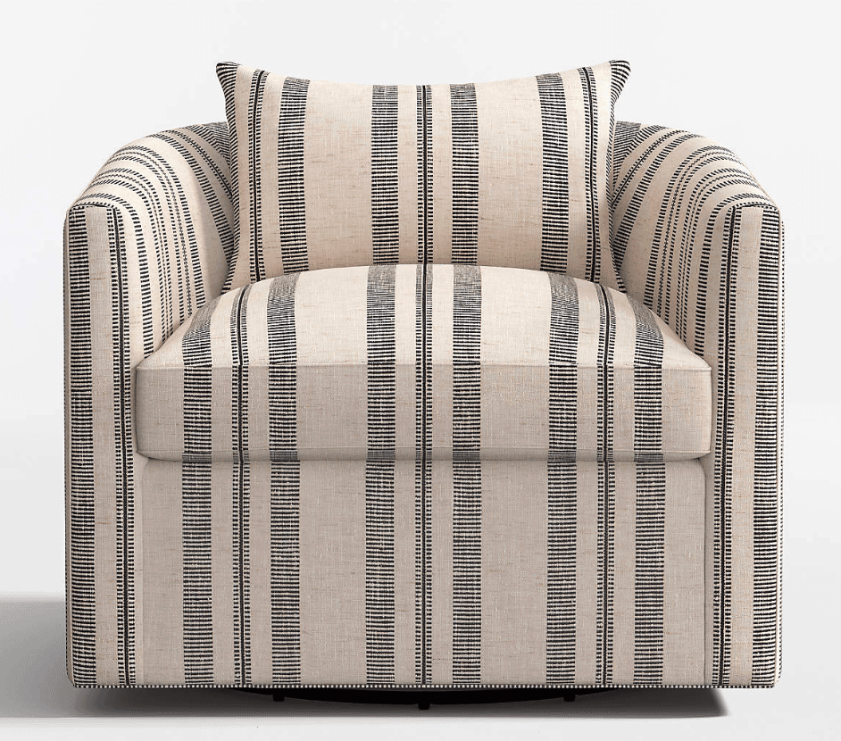 A contemporary upholstered barrel armchair featuring a cream-colored fabric with vertical black stripes. The chair has a rounded back and arms, a loose seat cushion, and an accompanying throw pillow. It sits on a subtle swivel base, making it versatile for various room configurations. — 3D model