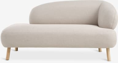 A modern upholstered chaise lounge with a single integrated seat and a rounded backrest that flows into an armrest on one side, supported by four short wooden legs. — 3D model