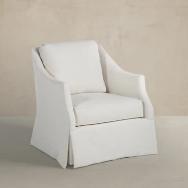 A fully upholstered accent chair featuring a single seat cushion, a loose back cushion, and a distinctive full skirt that extends to the floor, all rendered in a light, neutral-toned fabric. — 3D model