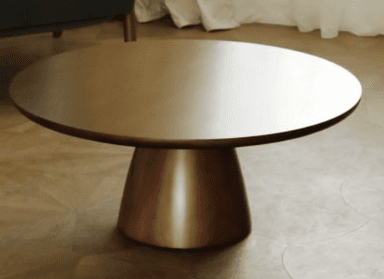 A robust, round coffee table featuring a thick, circular top and a substantial, tapering pedestal base, all finished in a uniform bronze tone. — 3D model