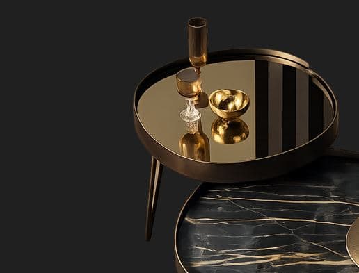 A small, round side table featuring a tray-like top with a mirrored surface, supported by three slender, tapered legs. The table has a dark bronze or black finish. — 3D model