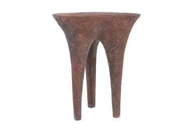 A small, three-legged end table with a textured, organic form. The tabletop is roughly circular and tapers downwards into three bulbous legs that spread outwards. The surface texture appears rough and pitted, suggesting a material like concrete, plaster, or a textured resin. — 3D model