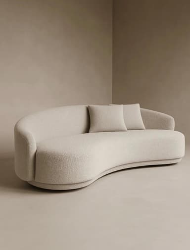 A contemporary, sculptural sofa featuring a deeply curved form, upholstered in a light beige boucle fabric. The design includes a low, asymmetric backrest that flows into an armrest on one side, and comes with two matching rectangular throw pillows. It rests on a subtle, integrated plinth base. — 3D model