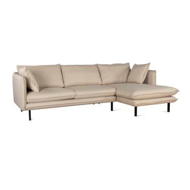 A modern sectional sofa with an integrated chaise lounge, upholstered in a light beige textured fabric, supported by slender black metal legs. — 3D model