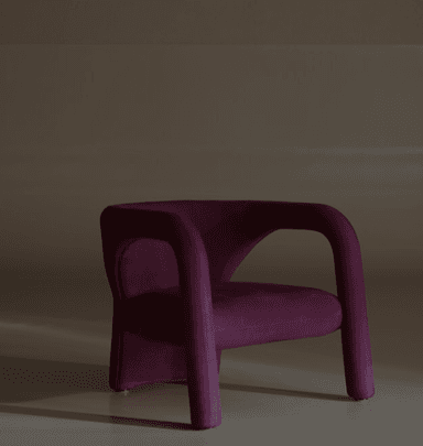 A compact, rounded lounge chair, upholstered in a deep magenta fabric, featuring a distinctive, sculptural silhouette with thick, continuous armrests and a low-slung seat. — 3D model