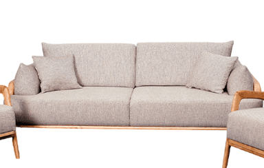 A modern three-seater sofa characterized by a prominent, exposed light-colored wooden frame and plush, light gray fabric upholstery. The sofa features clean lines, comfortable seating, and includes several matching loose throw pillows. Its design is minimalist yet inviting, suggesting a blend of comfort and contemporary aesthetics. — 3D model
