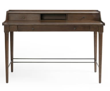 A dark brown wooden writing desk with a minimalist design. It features a raised back panel with three compartments: two drawers on the sides and an open shelf in the center. Below the main surface, there are two additional drawers, one on the left and one on the right. The desk is supported by four tapered legs and includes two horizontal metal bars for added stability and aesthetic detail. — 3D model