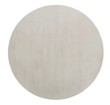 A round pedestal dining table with a light-colored finish. The table features a thick, banded tabletop with a subtle beveled edge. The pedestal base consists of a central square column from which four curved supports fan out, connecting to a wider, rectangular base with decorative moldings. The overall design suggests a transitional or modern farmhouse style. — 3D model