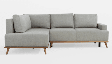 A light grey fabric sofa viewed from the rear and side. It features a three-seat configuration with distinct cushions visible at the top. The sofa has a modern design with clean lines, square arms, and is supported by a combination of dark and wooden tapered legs. The fabric appears to be a textured weave. — 3D model