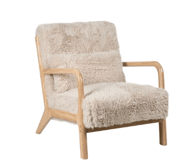 A contemporary lounge chair featuring a light-toned natural wood frame and plush, shaggy faux fur upholstery in an off-white or cream color. The design emphasizes comfort and a cozy aesthetic, suitable for modern interior settings. The frame has clean lines with rounded armrests and tapered legs. — 3D model