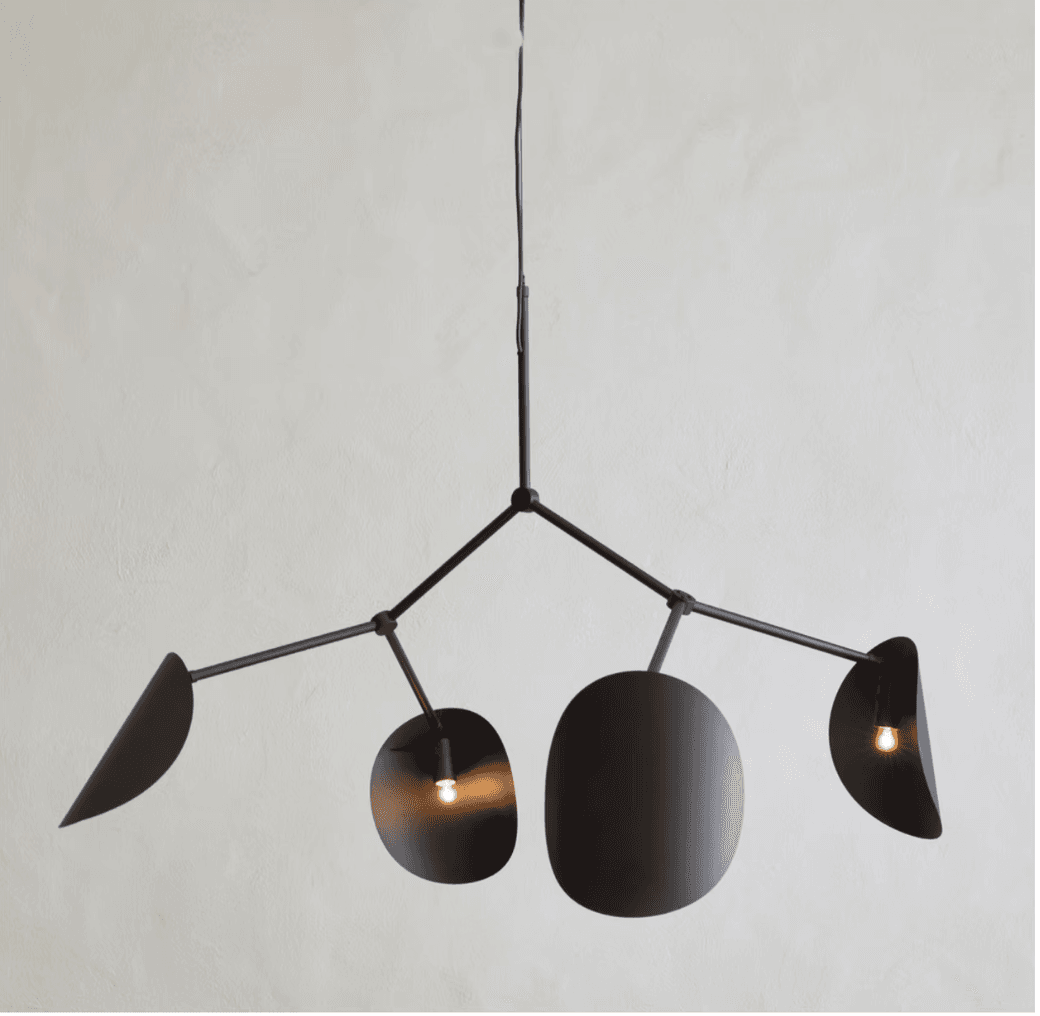 A modern, multi-arm chandelier featuring a matte black finish and abstract, organic-shaped shades, suspended from a single ceiling drop. The design evokes a mobile sculpture, with several light sources providing ambient illumination. — 3D model