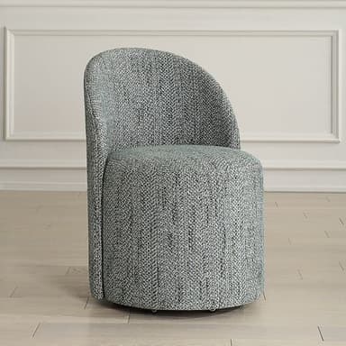 A modern armchair with a curved back and a rounded seat. The armchair is upholstered in a textured fabric with a grey and white speckled pattern. It appears to be a single-piece molded shell structure. — 3D model