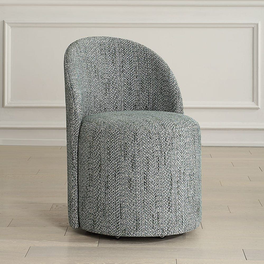 A modern armchair with a curved back and a rounded seat. The armchair is upholstered in a textured fabric with a grey and white speckled pattern. It appears to be a single-piece molded shell structure. — 3D model