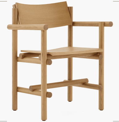 A wooden armchair with a minimalist and modern design. The chair features a curved backrest, a gently sloped seat, and armrests supported by cylindrical elements. The frame is constructed from solid wood with visible joinery, suggesting a focus on craftsmanship and natural materials. The legs are straight and supported by horizontal wooden pieces. — 3D model