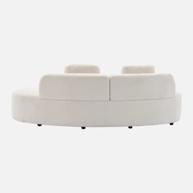 A cream-colored, curved sofa with a textured fabric upholstery, possibly bouclé or sherpa. It features a rounded silhouette and appears to have separate seating sections. The backrest is segmented and slightly curved, with two distinct upright back cushions visible. The sofa sits on low, dark-colored legs. — 3D model