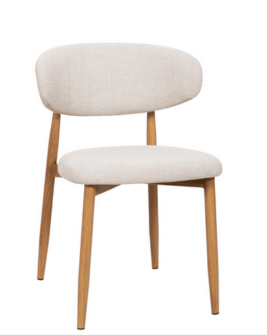 A contemporary armless chair featuring a light beige/cream upholstered seat and a gently curved backrest. It sits on four slender, tapered wooden legs, providing a warm, natural contrast to the neutral upholstery. The design is minimalist and functional, indicative of Scandinavian aesthetics. — 3D model