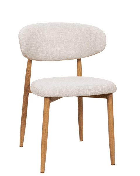 A contemporary armless chair featuring a light beige/cream upholstered seat and a gently curved backrest. It sits on four slender, tapered wooden legs, providing a warm, natural contrast to the neutral upholstery. The design is minimalist and functional, indicative of Scandinavian aesthetics. — 3D model